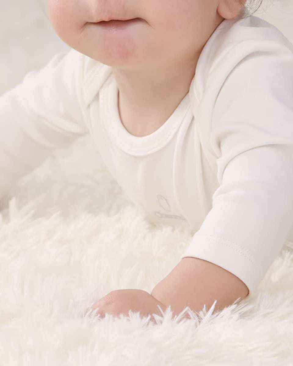 Signature Innocent Long Sleeve Bodysuit